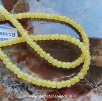 Gele Calsiet kralen rondel van 3 x 4 mm